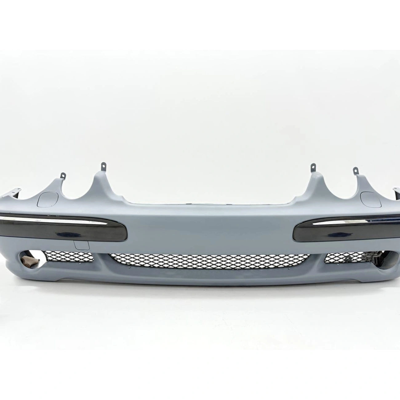 Front bumper assembly Mercedes-Benz W210 in AMG E55 Look style (2000-2002) for headlight washers